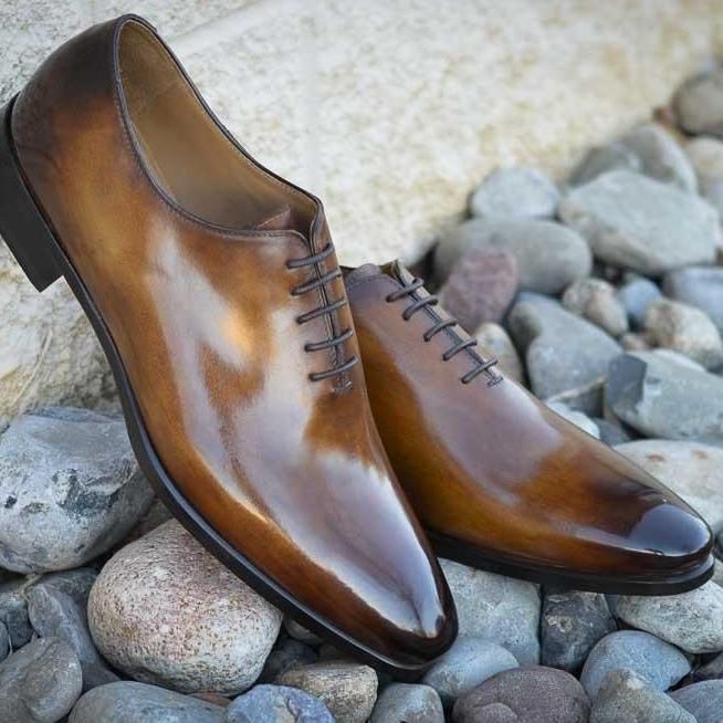 Wholecuts are the most formal dress shoes. Crafted from a single piece of leather uninterrupted by broguing or stitching. The perfect design for showing off a beautiful patina. Sleek and elegant and ready to elevate your shoe game to the next level. Hand painted patina Recraftable Blake Stitch construction Available in any color including unfinished white crust leather for a completely custom patina. Timeless Formal Lace-up Shoes With Leather Lining, Italian Cap Toe Oxfords For Office, Timeless Pointed Toe Dress Shoes With Goodyear Welt, Timeless Calf Leather Pointed Toe Oxfords, Timeless Italian Oxfords For Semi-formal Occasions, Timeless Pointed Toe Calf Leather Oxfords, Timeless Pointed Toe Oxfords With Leather Sole, Formal Goodyear Welted Plain Toe Oxfords, Semi-formal Oxfords With Almond Toe And Leather Lining