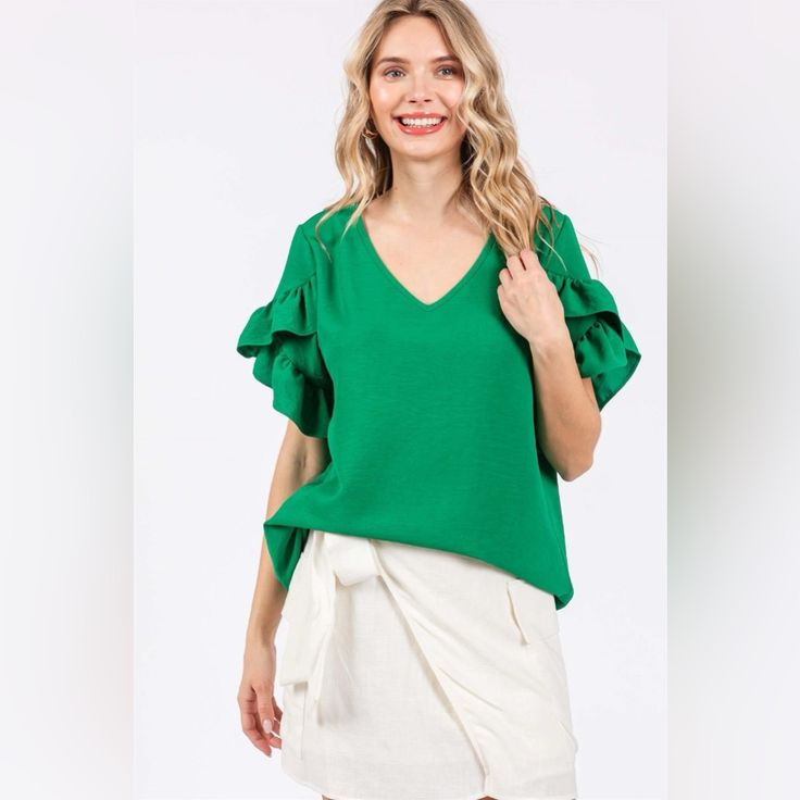 Elevate Your Wardrobe With Our Ruffled Short Sleeve V-Neck Blouse! This Elegant Blouse Features Charming Ruffled Details And A Flattering V-Neckline. The Short Sleeves Add A Touch Of Sophistication, Making It Perfect For Both Casual And Formal Occasions. Made From Soft And Breathable Fabric, It Ensures All-Day Comfort. Available In A Selection Of Beautiful Colors To Suit Every Style. Update Your Look With This Stylish And Versatile Blouse That Will Effortlessly Take You From Day To Night! Featur Ruffle Sleeve Blouse, Elegant Blouses, Ruffle Shorts, V Neck Blouse, Work Attire, Kelly Green, Stretchy Material, Jumpsuit Dress, Breathable Fabric