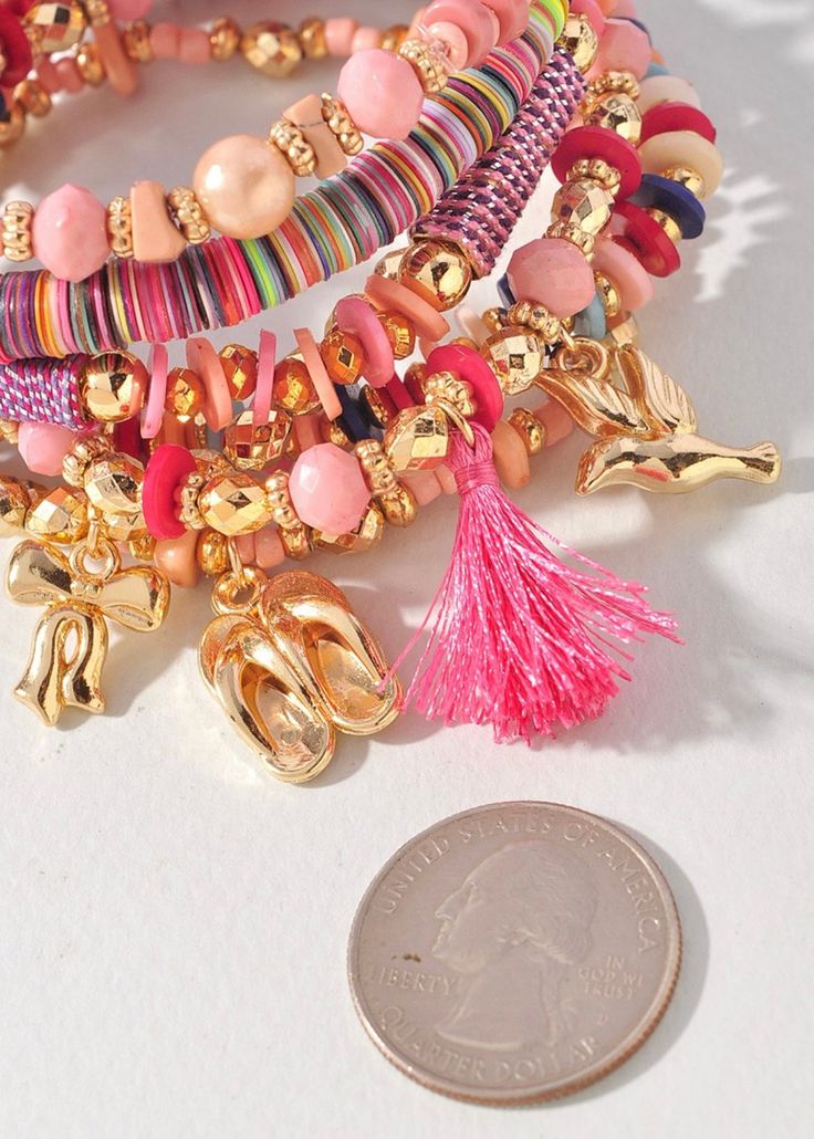 Add a touch of whimsy to your accessory game with our Beaded Charm & Shell Bracelet Set. Each bracelet features a unique assortment of colorful beads and charming puka shells. Perfect for those who like to mix and match for a playful and fun look. Bohemian Charm Bracelet For Beach, Multicolor Bohemian Charm Bracelet For Friendship, Bohemian Multicolor Charm Bracelet For Friendship, Multicolor Heishi Beads Bracelets For Vacation, Playful Colorful Beaded Bracelets For Vacation, Playful Heishi Beads Bracelets For Beach, Pink Heishi Beads Friendship Bracelets For Vacation, Beachy Multicolor Friendship Bracelets With Colorful Beads, Playful Multicolor Beaded Bracelets For Vacation