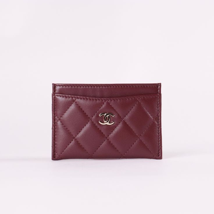 * Burgundy Quilted Lambskin Leather* Silver-Tone Hardware * Interlocking CC Accent at Front Face* Four Card Slots* Tonal Stitching * Dimensions: L 4.3" x H 3" Ysl Card Holder Hearts, Luxury Classic Red Card Holder, Burgundy Car, Chanel Card Holder, Dream Wishlist, Red Chanel, Classic Card, Front Face, Car Holder