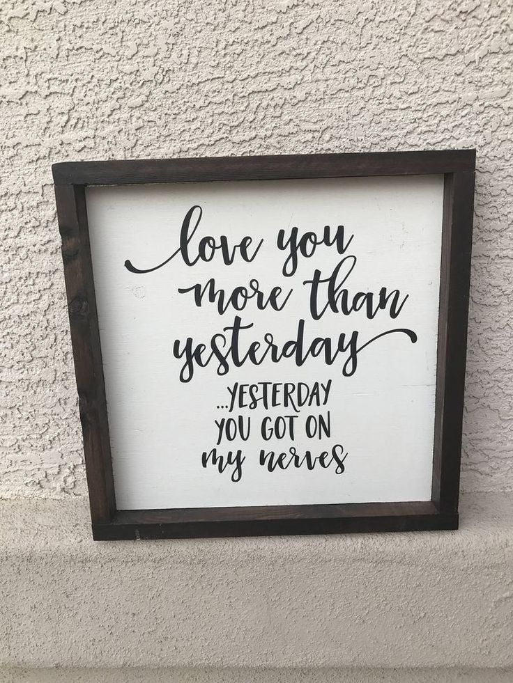 a sign that says love you more than yesterday today, and the words on it are written