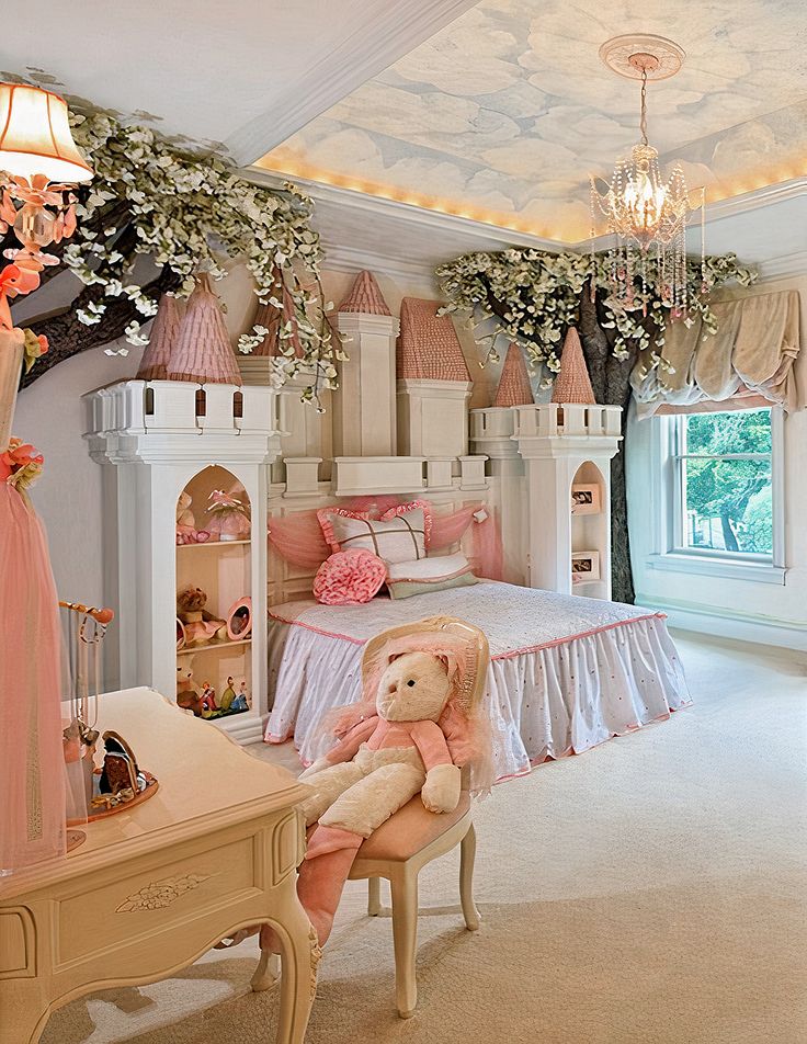 a bedroom decorated in pink and white with a teddy bear