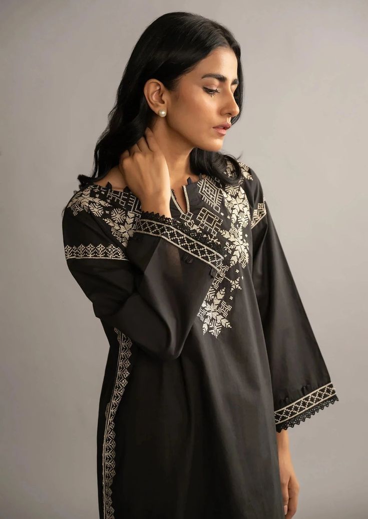 Women Kurta (Shirt Only). Description A solid black look with modern day style embedded on traditional canvas with elegant embroidery on fine lawn fabric. A day to day solid statements from Dhanak’s black and white collection. Black Embroidered Fabric For Designer Wear During Eid, Traditional Tops With Dabka For Eid, Festive Black Embroidered Top With Floral Details, Elegant Black Blouse With Intricate Embroidery, Festive Black Embroidered Floral Top, Festive Black Floral Embroidered Top, Black Cotton Straight Kurta, Traditional Black Cotton Set, Unstitched Black Resham Embroidered Fabric