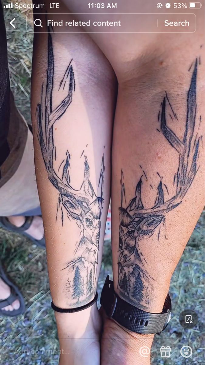 two people with tattoos on their legs, one is holding the other's leg