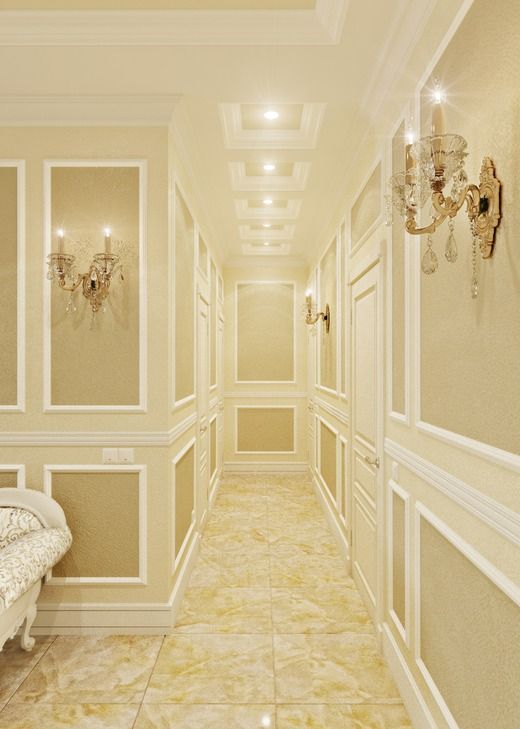 a long hallway with chandeliers and white furniture on either side of the room