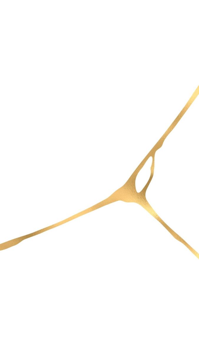 a pair of gold scissors on a white background