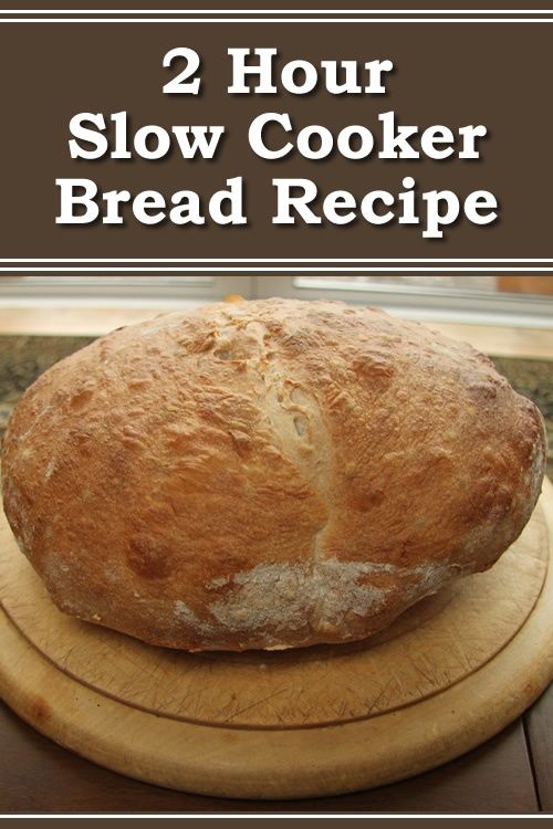 a loaf of bread sitting on top of a cutting board with the words 2 hour slow cooker bread recipe