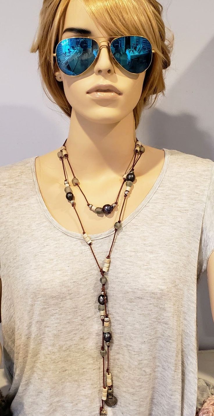 LARGE PEACOCK PEARLS Large freshwater peacock pearls, African old Nigerian rustic glass goomba beads and gray beach glass beads. Artfully combined and knotted on natural brown genuine leather with vintage coin on the end. Tie this necklace several ways to get the the most from a single piece of jewelry. You'll want this unique necklace next time you stroll along the coast! • Wear With Different Necklines. • Genuine Cultured Pearls• 60" Long You can have the charm engraved with one initial. Just Bohemian Single Strand Lariat Beaded Necklaces, Bohemian Single Strand Beaded Necklaces For Layering, Bohemian Single Strand Lariat Beaded Necklace, Bohemian Brown Lariat Beaded Necklaces, Earthy Long Adjustable Beaded Necklace, Bohemian Lariat Necklace With Round Beads, Bohemian Single Strand Lariat Necklace With Round Beads, Rustic Adjustable Beaded Necklaces, Bohemian Hand Wrapped Necklaces For Layering