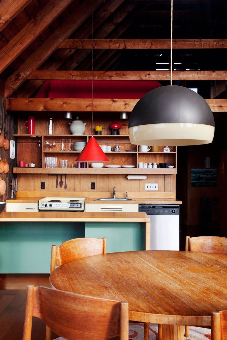 a kitchen with wooden cabinets and green counter tops