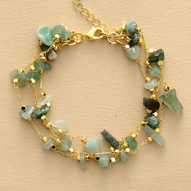 Introducing the perfect accessory for adding a touch of elegance to any outfit - the Gold Plated Aventurine Gemstone Multi-Layered Bracelet. Featuring a stunning combination of gold-plated chains and beautifully crafted aventurine gemstones, this bracelet is sure to turn heads wherever you go. Each layer adds a unique touch, creating a bold and dynamic statement piece that you'll love to wear day after day. Features: Versatile accessory. Comes in green or purple High-quality gold plating for a l Multi Layer Bracelet, Gemstone Chips Jewelry, Amethyst Crystal Bracelet, Aventurine Jewelry, Moon Dance, Healing Gemstone Bracelets, Green Aventurine Crystal, Layered Bracelet, Aventurine Crystal