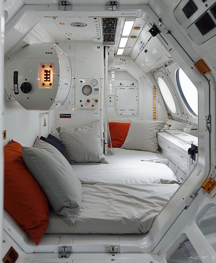 the interior of a space shuttle cabin with bed and pillows on it's side