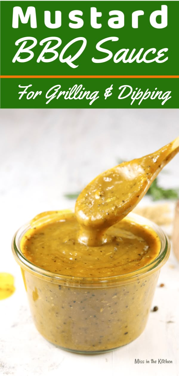 mustard sauce in a glass jar with a spoon full of it and the text mustard bbq sauce for grilling and dipping