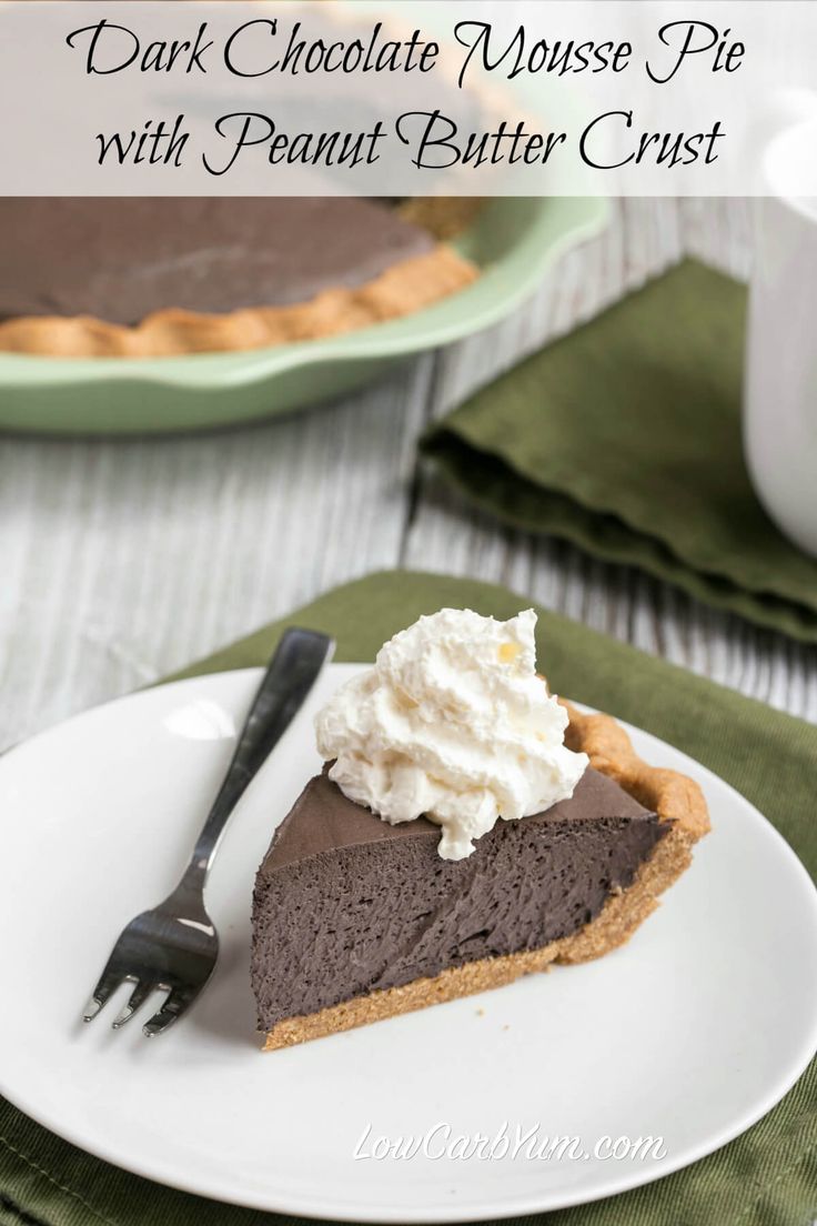 a slice of chocolate pie with whipped cream on top and a fork next to it