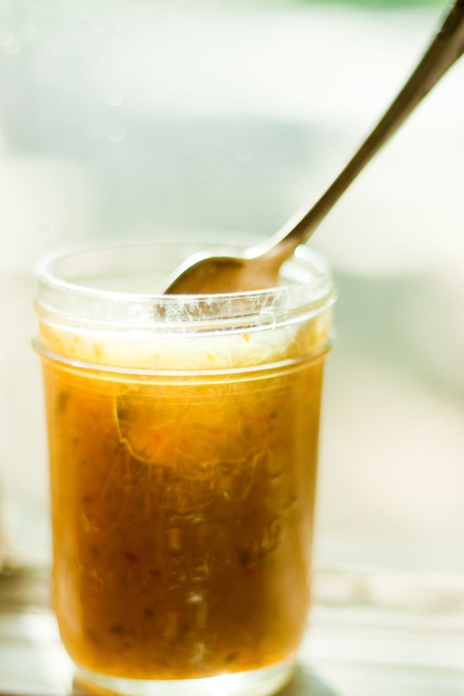 a spoon in a jar filled with liquid