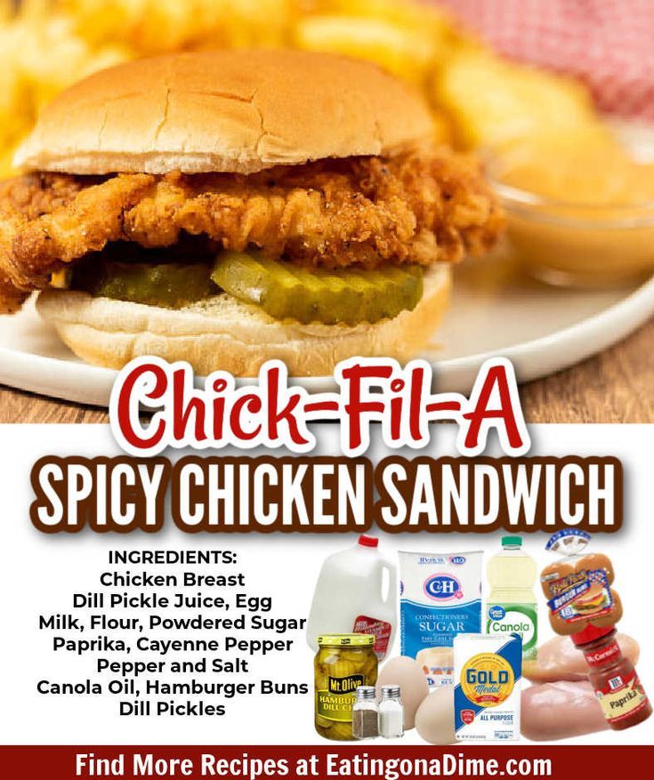 a chicken sandwich on a plate next to some french fries and ketchup bottles