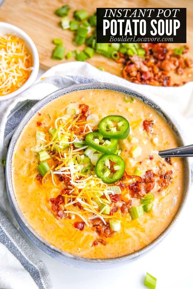 instant pot potato soup in a bowl with green peppers and shredded cheese on the side