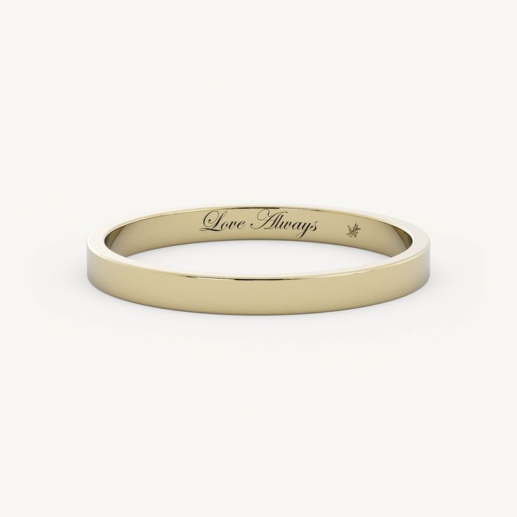 a yellow gold wedding band with the words give hope engraved on it's side