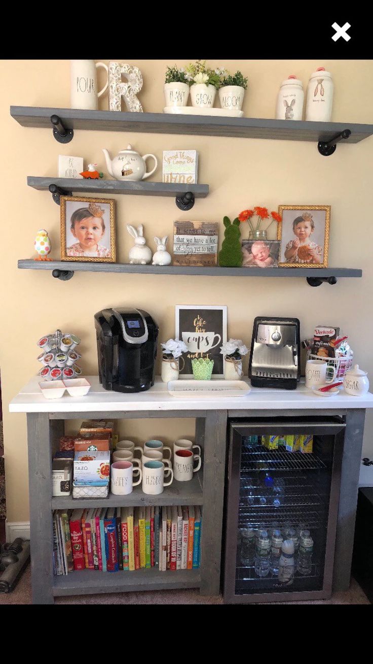 a coffee bar with shelves and pictures on the wall