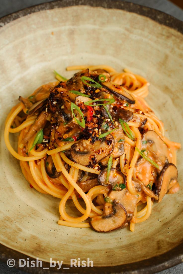 pasta with mushrooms and sauce in a bowl