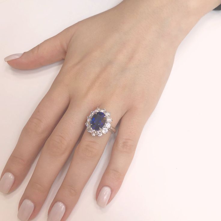 Classic, elegant and contemporary styled oval cut Ceylon blue sapphire 7.10 carat center stone. Accented by round diamonds 2.28 carat total. Diamonds are white and natural and in G-H Color Clarity VS. Platinum 950 metal. Width: 1.7 cm Height: 2 cm Weight: 14.88 g [shortcode] [video] [/video] [/shortcode] Oval Sapphire Engagement Ring, Wedding Trousseau, Vision 2024, Oval Sapphire Ring, No Wrinkles, Tanzanite Engagement Ring, Ceylon Blue Sapphire, Future Engagement Rings, Platinum Diamond Rings