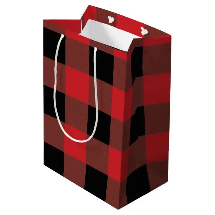 a red and black checkered shopping bag with a white tag hanging from the handle