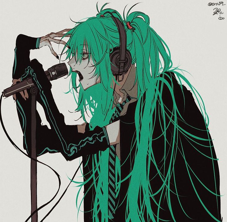 a person with green hair and headphones holding a microphone