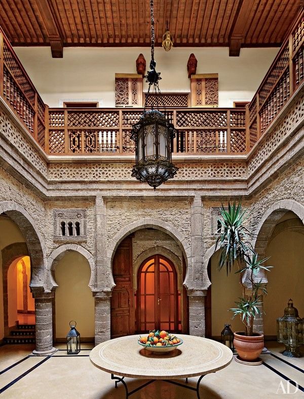 the inside of a large building with lots of stone and woodwork on it's walls