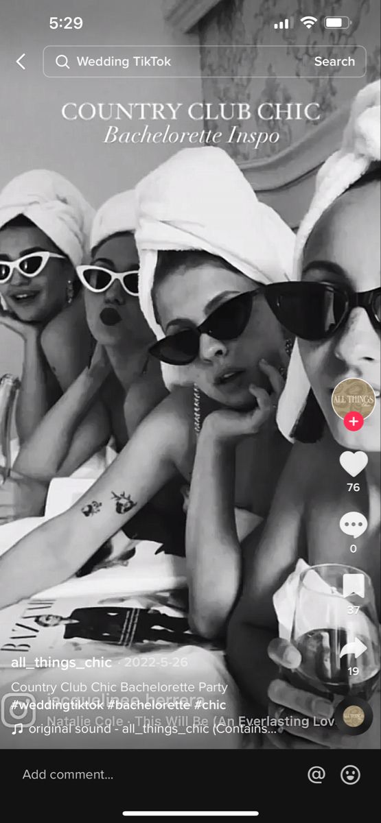 an image of a group of women in bathing suits and sun glasses on their cell phones