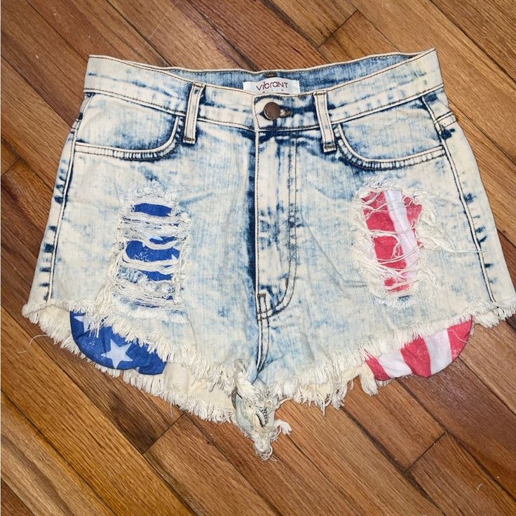 These Cheeky Shorts Are A Size Medium In Women’s Sizing And 98% Cotton With 2% Spandex. It Was Never Worn But Without Tags, With Two Pockets On The Front And Back. The Front Has A Ripped Style Which Shows The Inside Pockets Of The American Flag. One Side Is Red And White Pocket Stripes And Other Is A Blue And White Star Pocket. It Is A Washed Denim Style. It Was Purchased From A Boutique In Brooklyn. 4th Of July Jean Shorts, Trendy High Waist Bottoms For 4th Of July, Trendy High-waist Bottoms For 4th Of July, Trendy Cutoff Shorts For 4th Of July, Trendy American Flag Print Bottoms For 4th Of July, High Waist Bottoms For 4th Of July, High-waisted Bottoms For 4th Of July, Americana Style Blue Bottoms For 4th Of July, Patriotic Fitted Bottoms For 4th Of July