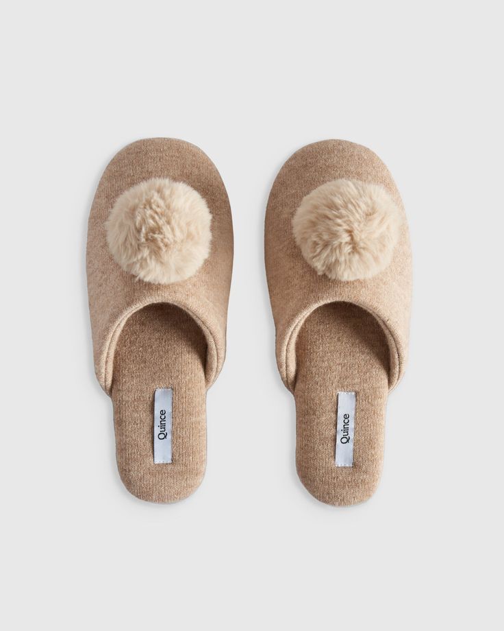 Few things are more luxurious than draping yourself in cashmere—and there’s no reason your feet should miss out on the fun. Soft, cozy and crafted from the finest Mongolian cashmere, these slippers deliver lightweight plushness with a memory foam insole that will have you feeling like you’re walking on air. Add in that they’re easy to slip on with a no-skid bottom and you’ve found your new favorite shoe. Cashmere Socks, Cashmere Throw, Trouser Socks, Soft Sock, Moccasins Slippers, Slippers Cozy, Faux Fur Pom Pom, On Air, House Shoes