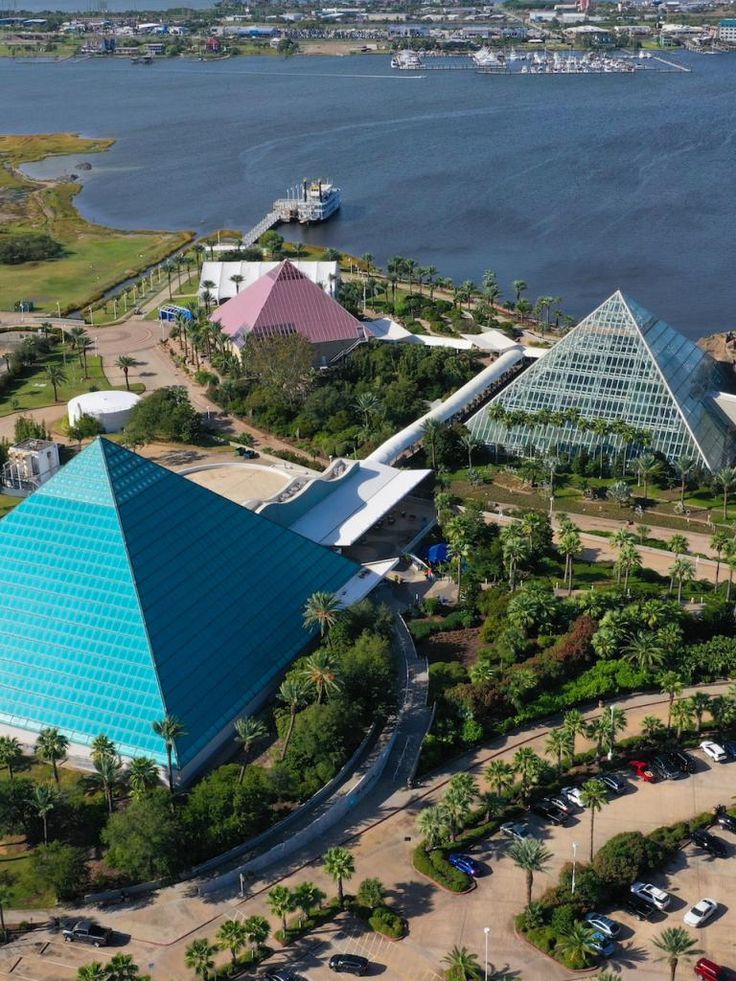 an aerial view of some buildings near the water