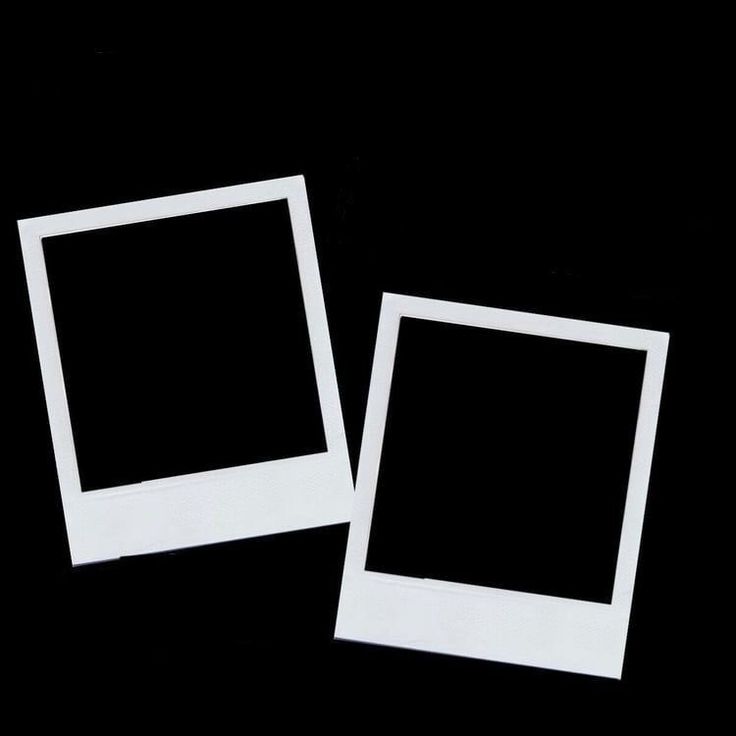 two white polaroid frames sitting next to each other on a black surface with one empty