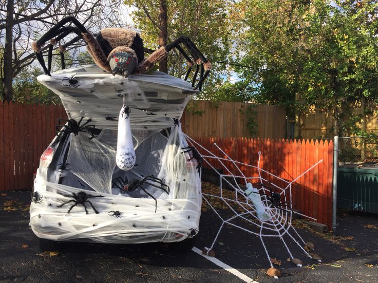 an inflatable car with spider decorations on it