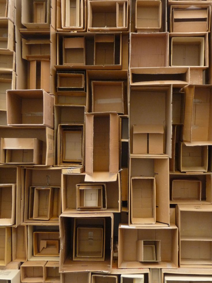 many wooden boxes stacked on top of each other in different shapes and sizes, all lined up together