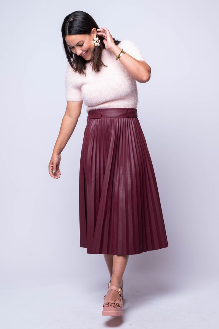 The Pelia Pleated Midi is a must-have for any wardrobe. This midi skirt features delicate pleating, an elastic back panel for a comfortable fit, and is made from luxurious burgundy vegan leather. Its A-line design flatters any figure and adds a touch of sophistication to any outfit. Hand Wash Cold Import 55% PU | 45% Viscose Fit Guide: Tabatha is 5ft 3 inches; Bust 34”, Waist 24”, Hips 36” Model is wearing a size small True to size *available at our Bandit location Line Design, Vegan Leather, Midi Skirt, A Line, Comfort Fit, Hand Wash, Elastic, Skirt, Wardrobe