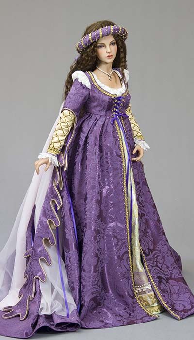 a doll in a purple dress with gold trim