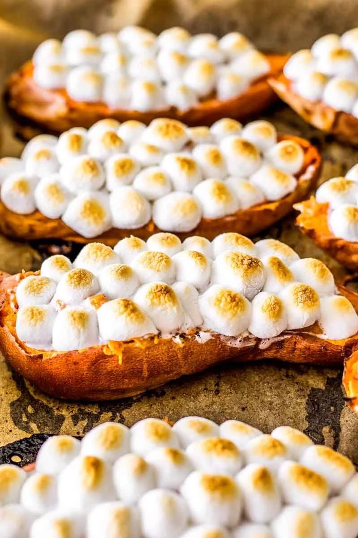 baked sweet potatoes with marshmallows on top and the words twice baked candied sweet potatoes