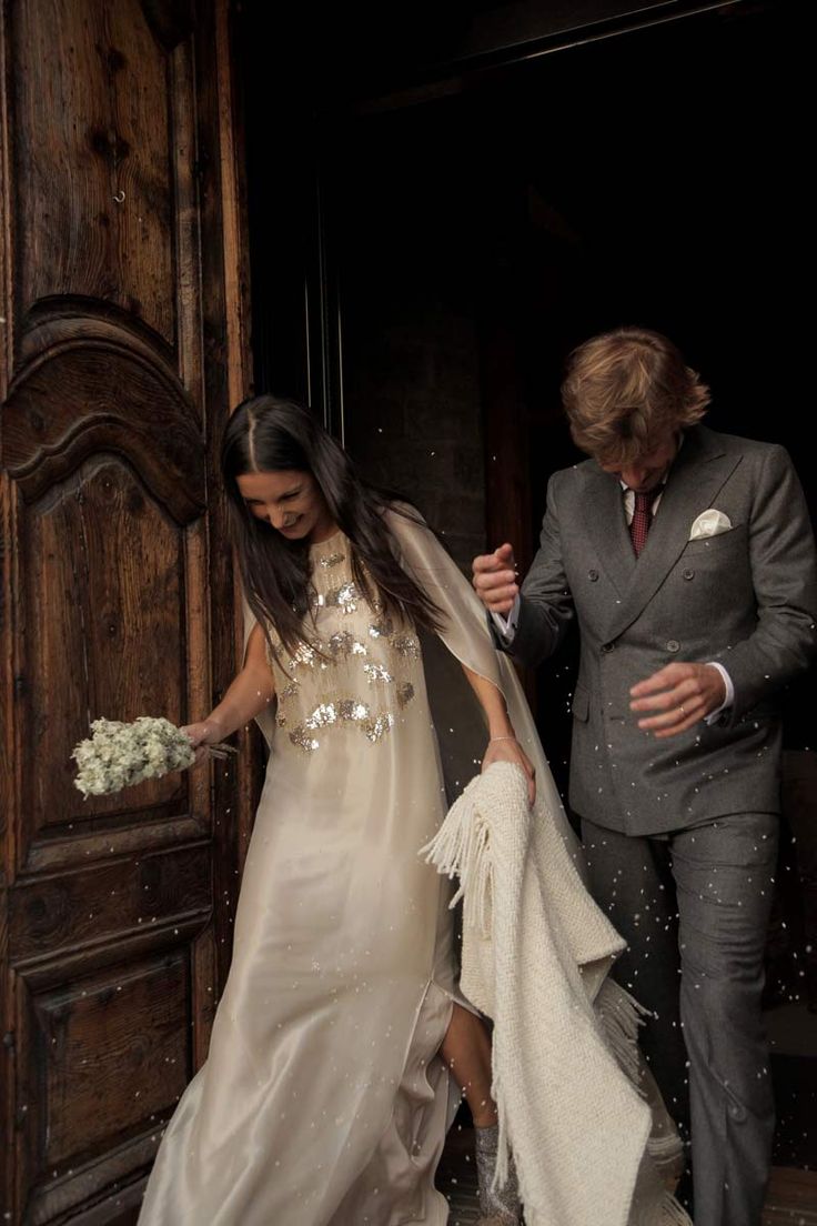 a bride and groom exiting the church together