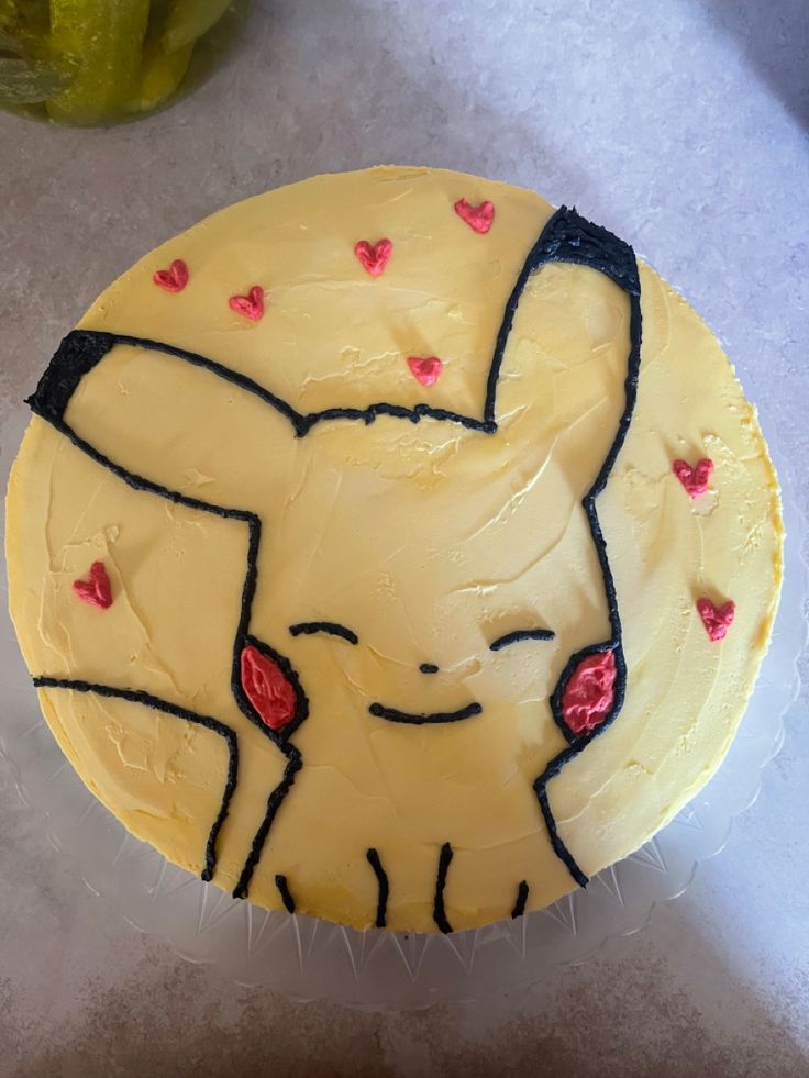 a cake decorated with an image of a pikachu