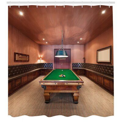 a pool table in the middle of a room with couches and lamps on either side