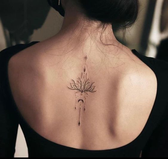 a woman with a tattoo on her back