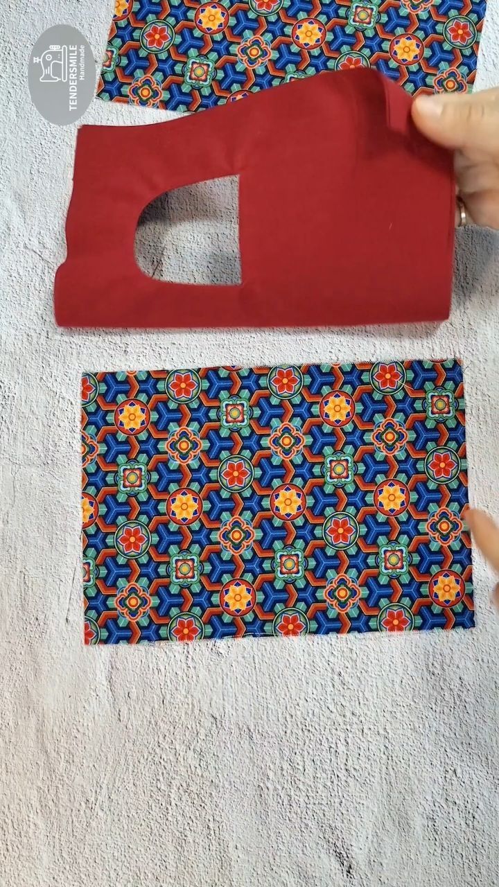 two pieces of fabric are being cut out