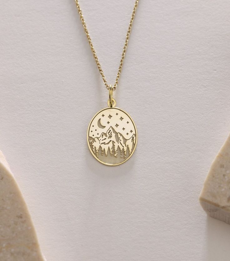 Gold Mountain Pendant - Mountain  Gold Necklace ● Material of pendant: Solid Gold 14k ( REAL GOLD ) ● Metal Stamp: 14k ( REAL GOLD ) ● The pendant is available in 5sizes: - 12x17 mm / 0,47 x 0,66 inches - 13x18 mm / 0,51 x 0,70 inches  In the photos - 14x19 mm / 0,55 x 0,74 inches  - 16x21 mm / 0,62 x 0,82 inches  - 18x24 mm / 0,70 x 0,94 inches ( In the photos the size is 13x18 mm / 0,51 x 0,70 inches ) ( Jump Ring inner diameter: 4 mm ) ● Material of chain: Solid gold 14k ( REAL GOLD ) It is thin and dainty and it is available in 4 sizes: - 40 cm / 15,75 inches ( Length ) - 45 cm / 17,72 inches ( Length ) In the photos - 50 cm / 19,68 inches ( Length ) - 55 cm / 21,65 inches ( Length ) ● Backside engraving is FREE ( Please use the personalization box for that.) ● If you want larger size, Rose Gold Pendant Jewelry With Engraving Option, Nature-inspired Round Necklace For Anniversary, Nature-inspired Round Anniversary Necklaces, Nature-inspired Round Anniversary Necklace, Dainty Gold Necklaces With Engraving Option, Dainty Gold Necklace With Engraving Option, 14k Gold Necklace With Engraving Option, Nature-inspired Engraved Round Jewelry, 14k Gold Jewelry Pendant With Engraving Option