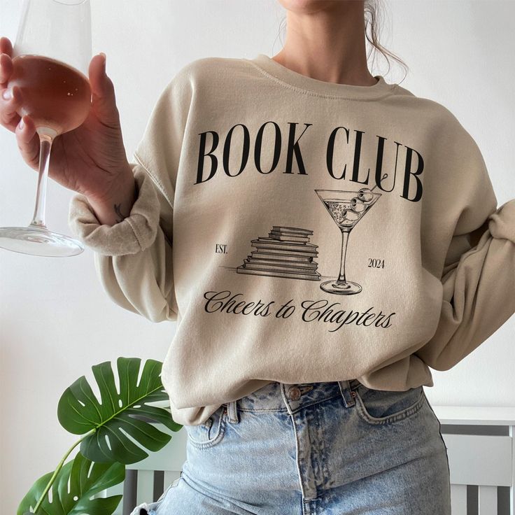 🎅Last day for Christmas orders Dec 8th🎄 📚 Welcome to our cozy corner of literary love! Introducing our Custom Book Club Sweatshirt - the perfect blend of comfort and bookish charm tailored just for you! Looking for a thoughtful and unique gift for your book club members or fellow bookworms? Look no further! Our Custom Book Club Sweatshirt makes for an unforgettable present that celebrates the shared passion for literature.📚 ♡ PRODUCT: We use the finest premium Gildan 18000 crewneck sweatshir Bookworm Shirt, Wine Book, Reading Club, Book Shirt, Gift For Book Lover, Wine Club, Bookclub Gifts, Reading Shirts, Club Sweatshirts