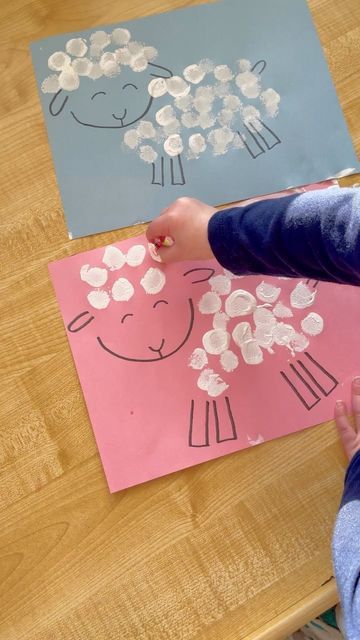 a child is making a paper sheep craft