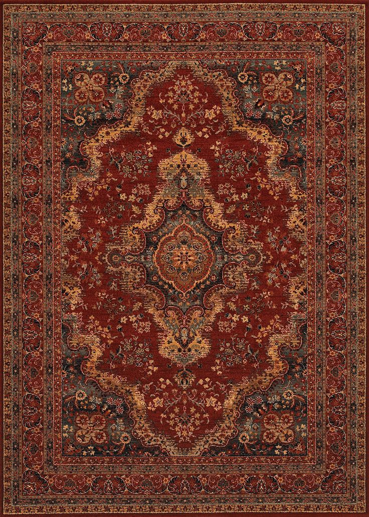 a red rug with an ornate design on the center and bottom, surrounded by smaller floral designs