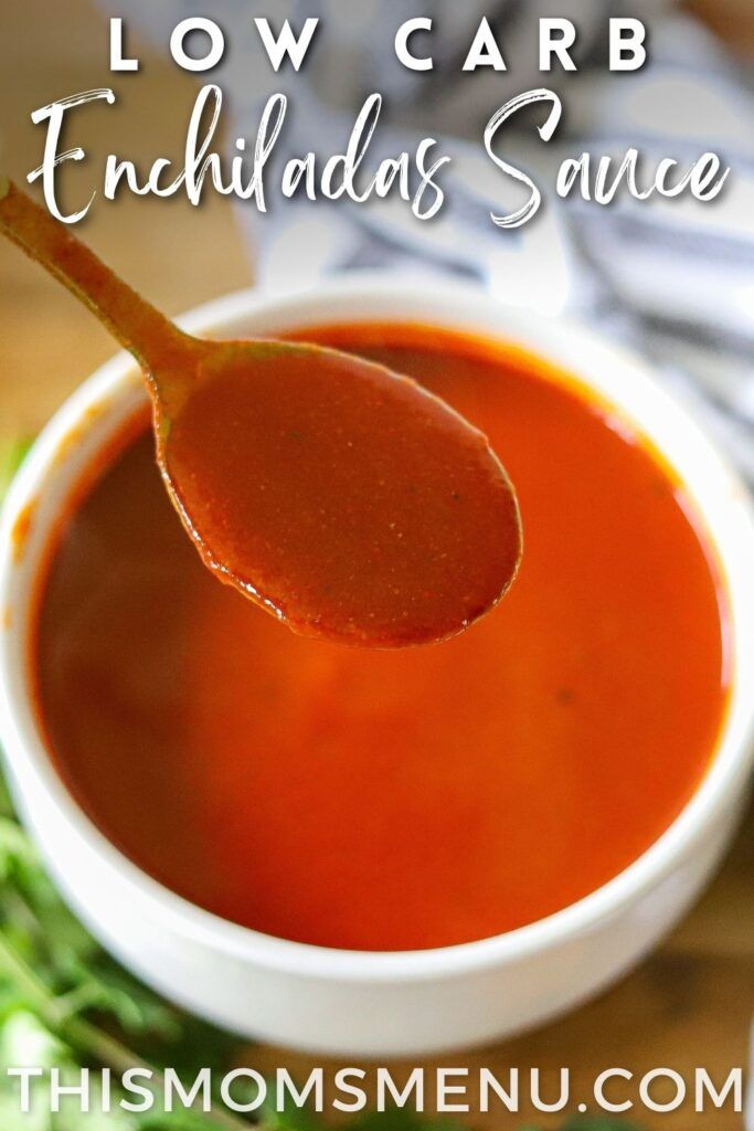 a spoon full of tomato soup on top of a wooden table with the words low carb