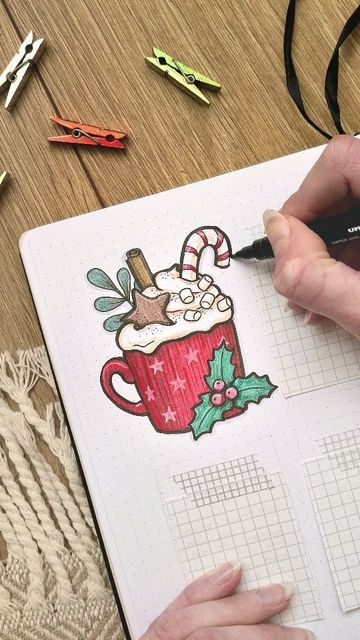 someone is making a christmas card with a cup of coffee and candy canes on it