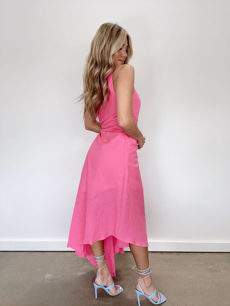 Delight in the exclusive design of the Modern Love Midi Dress, with a one shoulder detail and a side cutout that reveals a tasteful hint of skin. The tapered hem and gathered detail create a flattering silhouette for any figure, while the bright pop of color provides a chic, elevated look for spring and summer events or formal occasions. Celebrate your style in sophistication with this stylish and elegant dress. Self 55% Linen 45% Cotton Lining 100% Polyester Hand wash cold. Summer Halter Neck Dress With Side Slits, Spring One Shoulder Midi Dress With Side Slits, Spring One-shoulder Midi Dress With Side Slits, One Shoulder Midi Dress With Side Slits For Spring, Pink One-shoulder Midi Dress For Beach, Pink One-shoulder Midi Dress For Day Out, Flirty Pink One Shoulder Dress For Spring, Flirty Dresses With Asymmetrical Neckline For Spring, Flirty Spring Dress With Asymmetrical Neckline