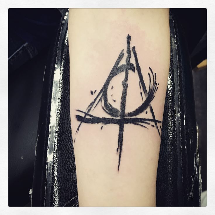 a black and white photo of a tattoo with an all seeing symbol on it's arm